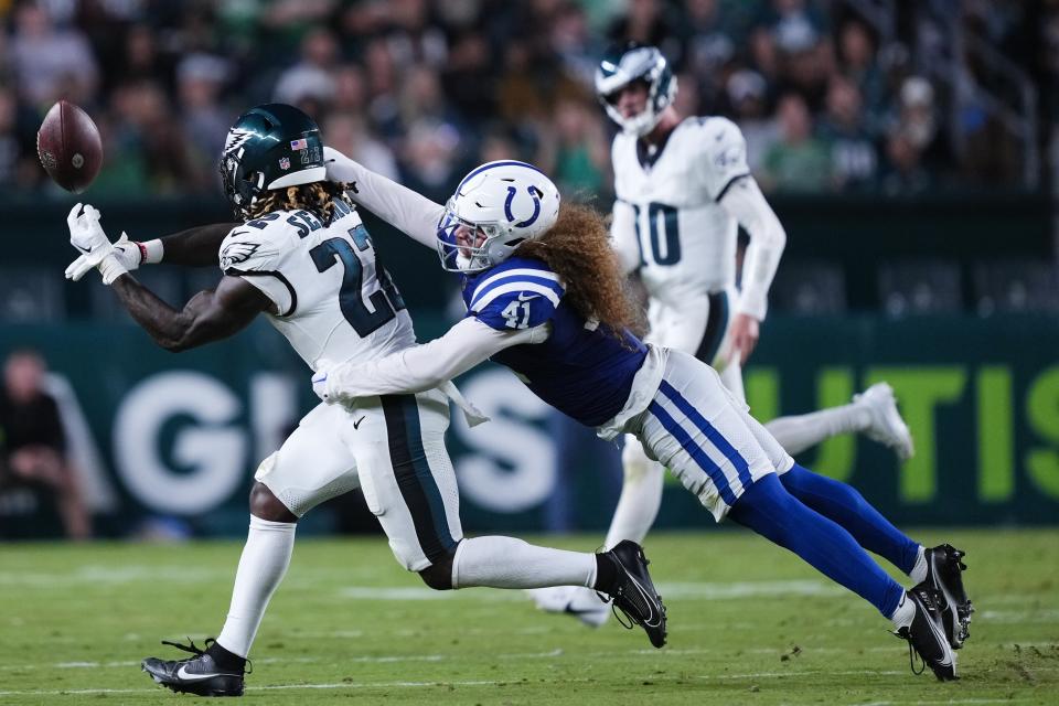 Philadelphia Eagles running back Trey Sermon (22) can't make a catch in front of Indianapolis Colts linebacker Grant Stuard (41) during the first half of an NFL preseason football game Thursday, Aug. 24, 2023, in Philadelphia. (AP Photo/Matt Rourke)