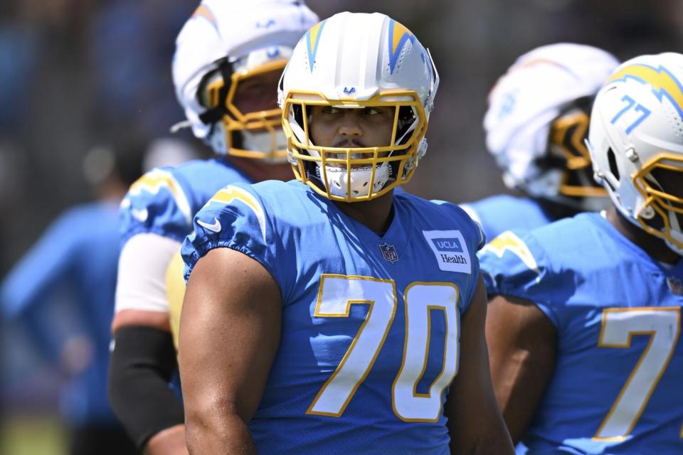 The Chargers left tackle Rashawn Slater looking across the field during training camp Friday in El Segundo.