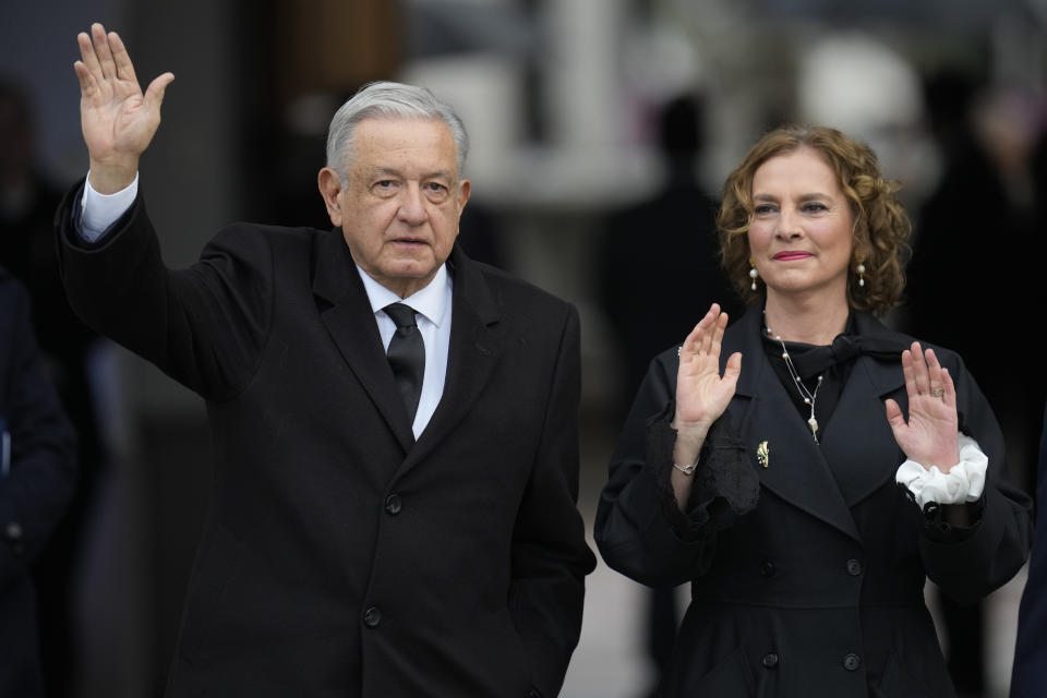 Mexico's President Andres Manuel Lopez Obrador, left, and wife Beatriz Gutierrez Muller enter La Moneda presidential palace for a ceremony marking the 50th anniversary of the military coup that toppled the government of late President Salvador Allende in Santiago, Chile, Monday, Sept. 11, 2023. (AP Photo/Esteban Felix)