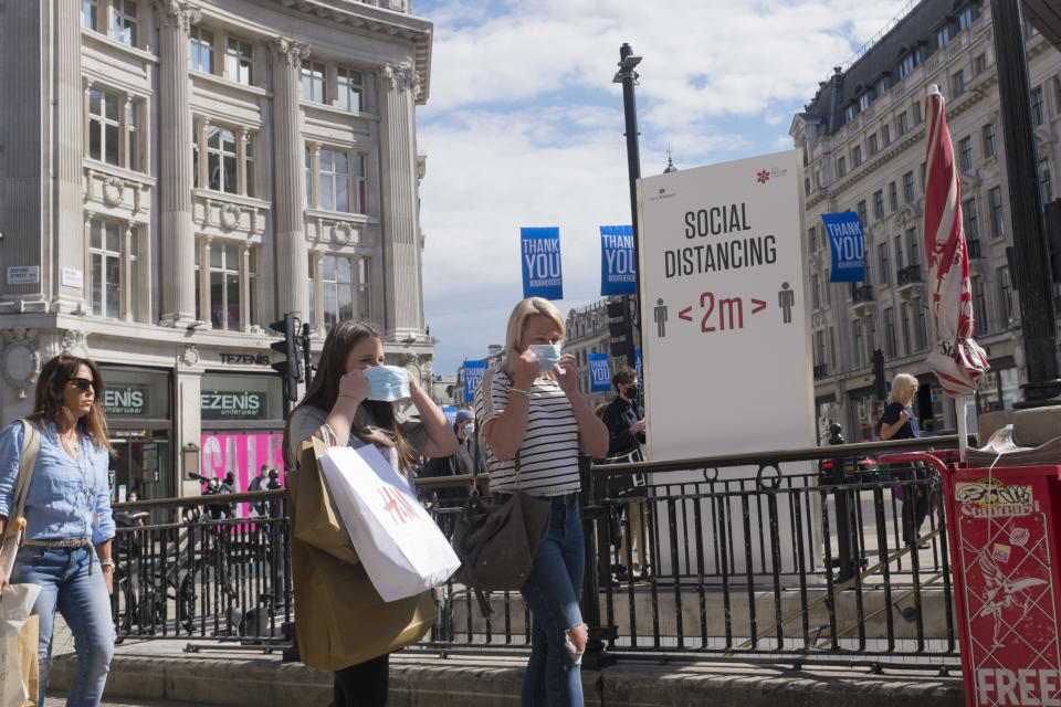 With a further 89 UK covid victims in the last 24hrs, bringing the total victims to 43,995 during the Coronavirus pandemic, shops continue opening along London's Oxford Street where social distance and hygiene advice towers are located at the only entrance to the underground station, where shoppers and users of public transport observe restriction rules by putting on face masks, on 2nd July 2020, in London, England. (Photo by Richard Baker / In Pictures via Getty Images)