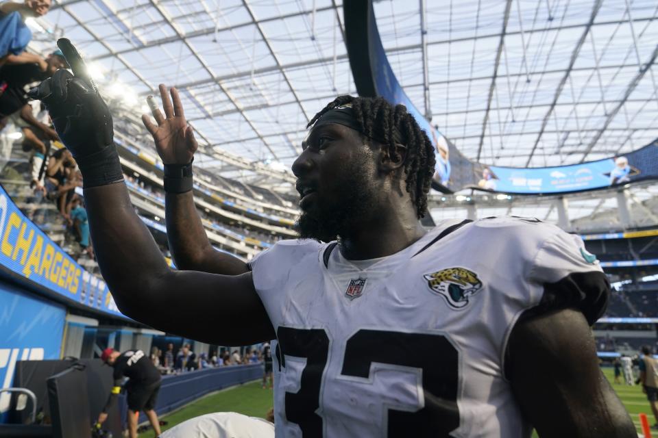 Jaguars linebacker Devin Lloyd (33) celebrates after having three pass breakups and an interception Sunday after his team routed the Los Angeles Chargers 38-10 at So-Fi Stadium, another sign the franchise is on the ascent.