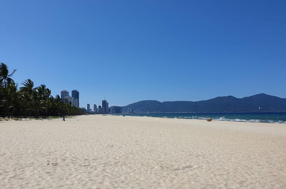 The once crowded beach is empty following a lockdown order in Da Nang, Vietnam, on Tuesday, July 28, 2020. Vietnam on Tuesday locked down its third-largest city for two weeks after more than a dozen cases of COVID-19 were found in a hospital. (AP Photo/Luke Groves)