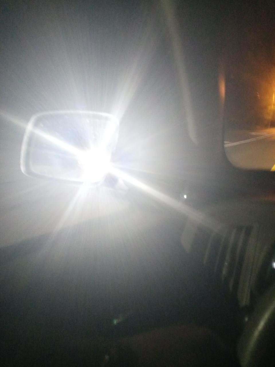 High beams on in someone's rearview mirror