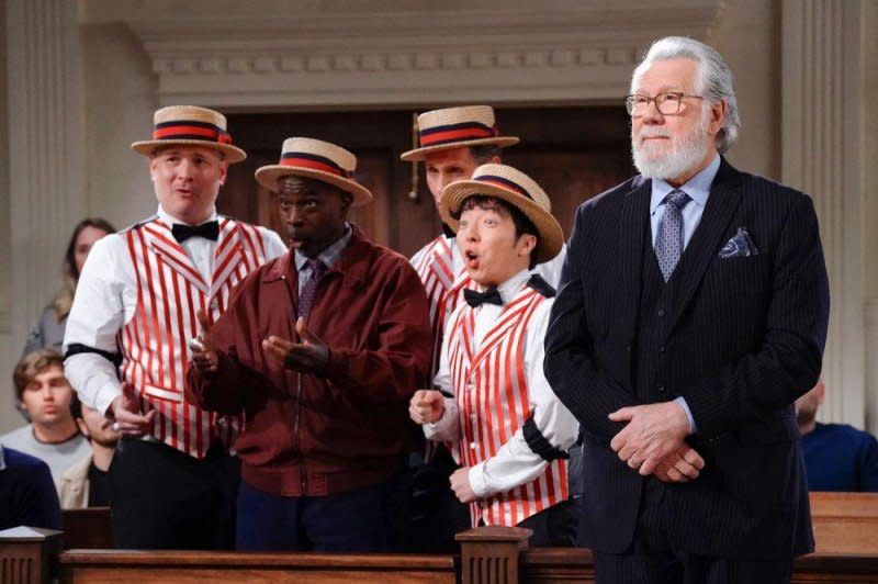 Dan (John Larroquette, R) hires a barbershop quartet to sing thank you to the court clerk. Photo courtesy of NBC