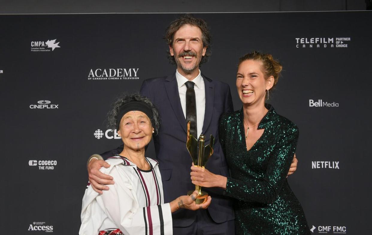 Writer Aaju Peter, left, producer Emile Hertling Péronard, centre, and director Lin Alluna, right, were on hand in Toronto to accept the best feature length documentary award at the 2024 Canadian Screen Awards.  (Submitted by George Pimentel Photography - image credit)