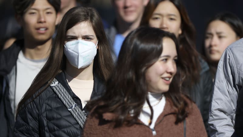 A young woman wears a KN95 mask in downtown Salt Lake City on Jan. 26, 2022.