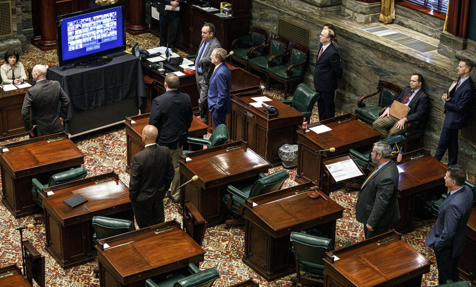 Republican state senators in Pennsylvania observe social distancing as other colleagues live-stream the session on Wednesday, March 25, 2020. The lawmakers vote on changing the primary election date, among other measures, in the first Senate session in state history where members can meet online and vote remotely due to the coronavirus pandemic. 