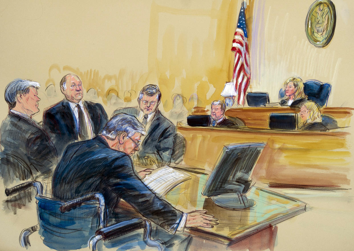 Paul Manafort, bottom, with members of his defense team 