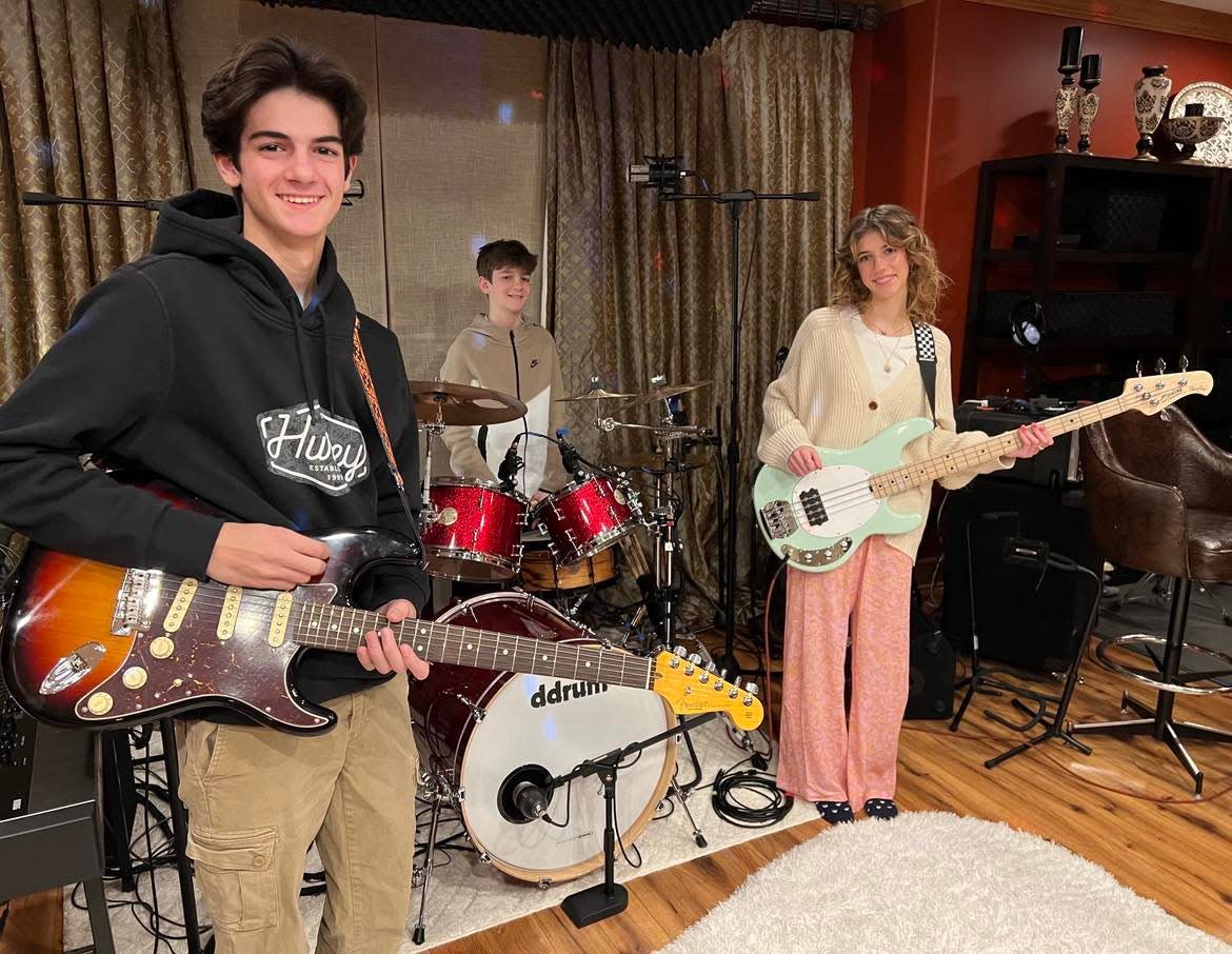 From left are the members of the pop rock band COMPASS, Harrison, Johnny and Arianna Kefalas. The siblings are students in Jackson Local Schools and will compete on Feb. 3 in the Tri-C High School Rock Off at the Rock & Roll Hall of Fame in Cleveland.