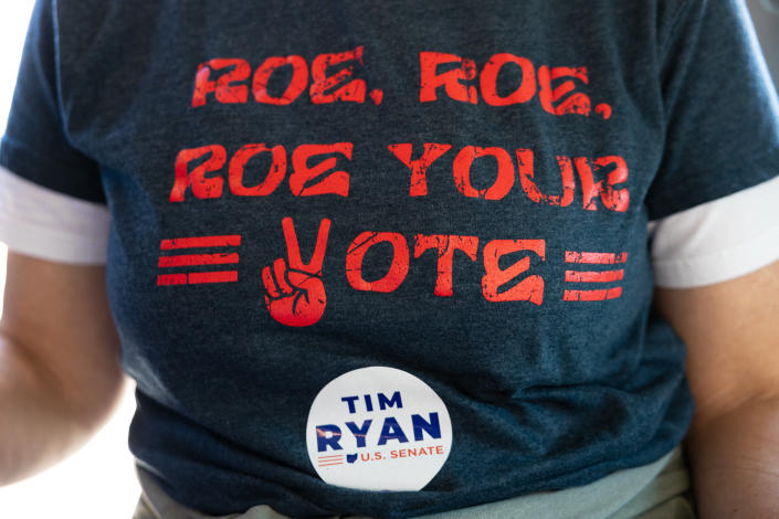 T-shirt emblazoned with: Roe, Roe, Roe your vote and a sticker that reads: Tim Ryan, U.S. Senate.