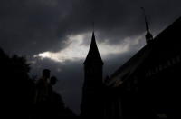 People walk past a Konigsberg Cathedral in the Baltic Sea port of Kaliningrad, Russia, July 18, 2015. REUTERS/Maxim Shemetov