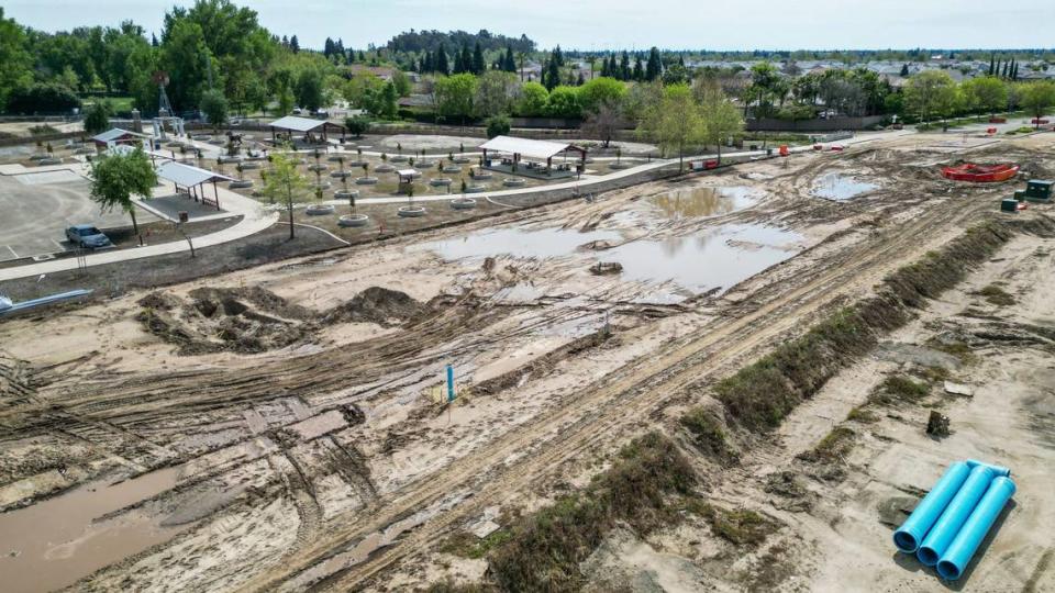 A muddy construction area is shown in this drone image at the intersection of Sunnyside and Shepherd near the Dry Creek trailhead in Clovis on Wednesday, April 17, 2024. The roads in that area have been closed since Jan. 1 for road widening and underground utilities work related to housing construction in the Heritage Grove growth area. Now city officials say it won’t reopen until the end of June.