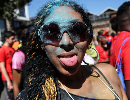 A young reveller takes part in the children's parade during the Notting Hill Carnival in London, Britain August 27, 2017. REUTERS/Eddie Keogh