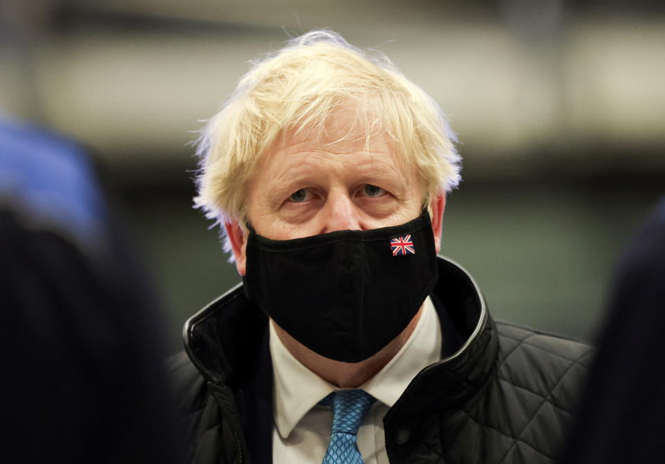 Prime Minister Boris Johnson wears a face mask during a visit to RAF Valley in Anglesey, North Wales. The Prime Minister is set to face further questions over a police investigation into partygate as No 10 braces for the submission of Sue Gray's report into possible lockdown breaches. Picture date: Thursday January 27, 2022.