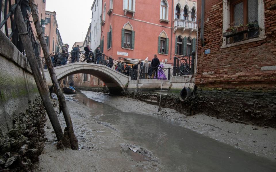 A dried canal in Venice during a low tide on February 21 - AP