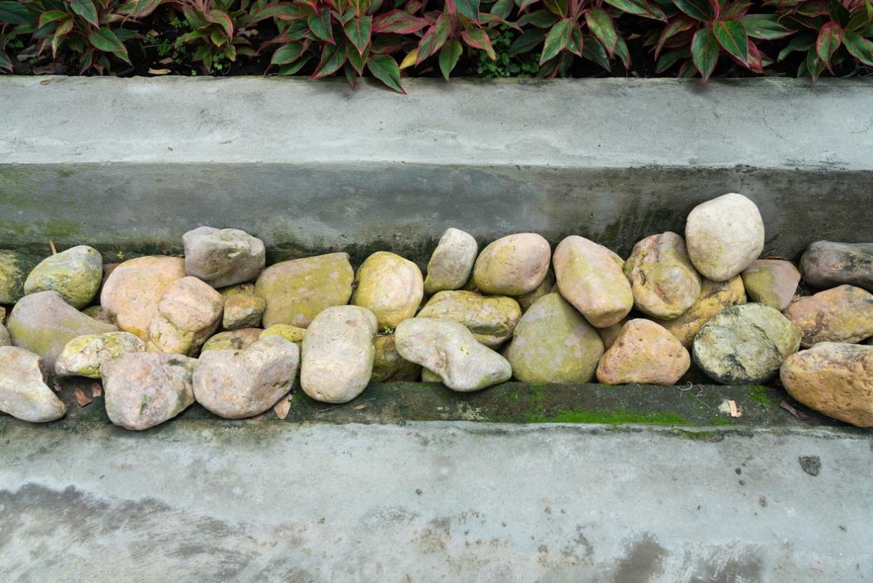 Pebbles in the drainage gutter