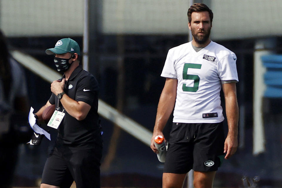 FILE - In this Saturday, Aug. 22, 2020, file photo, New York Jets quarterback Joe Flacco (5) during a practice at the NFL football team's training camp in Florham Park, N.J. Flacco passed his physical and will start the season on the New York Jets’ active roster as one of Sam Darnold’s backups. (AP Photo/Adam Hunger, File)