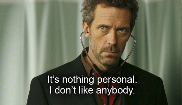 Hugh Laurie with a stethoscope in his ears on "House"