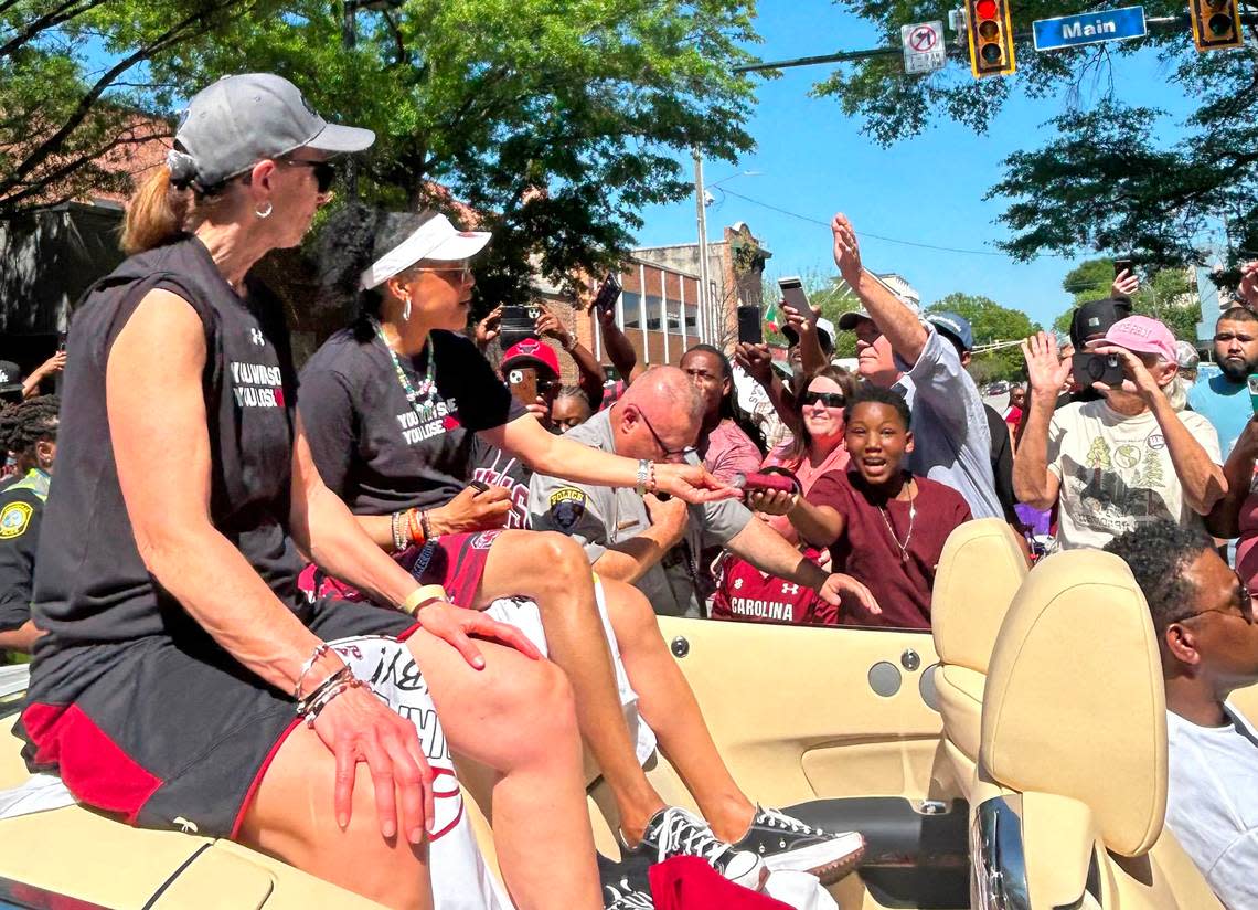 The city of Columbia holds a parade on Main Street to honor the South Carolina women’s basketball team’s 2024 national championship. Here, Dawn Staley and assistant coach Lisa Boyer ride together in a Rolls Royce on the parade route. Lauren Leibman/The State