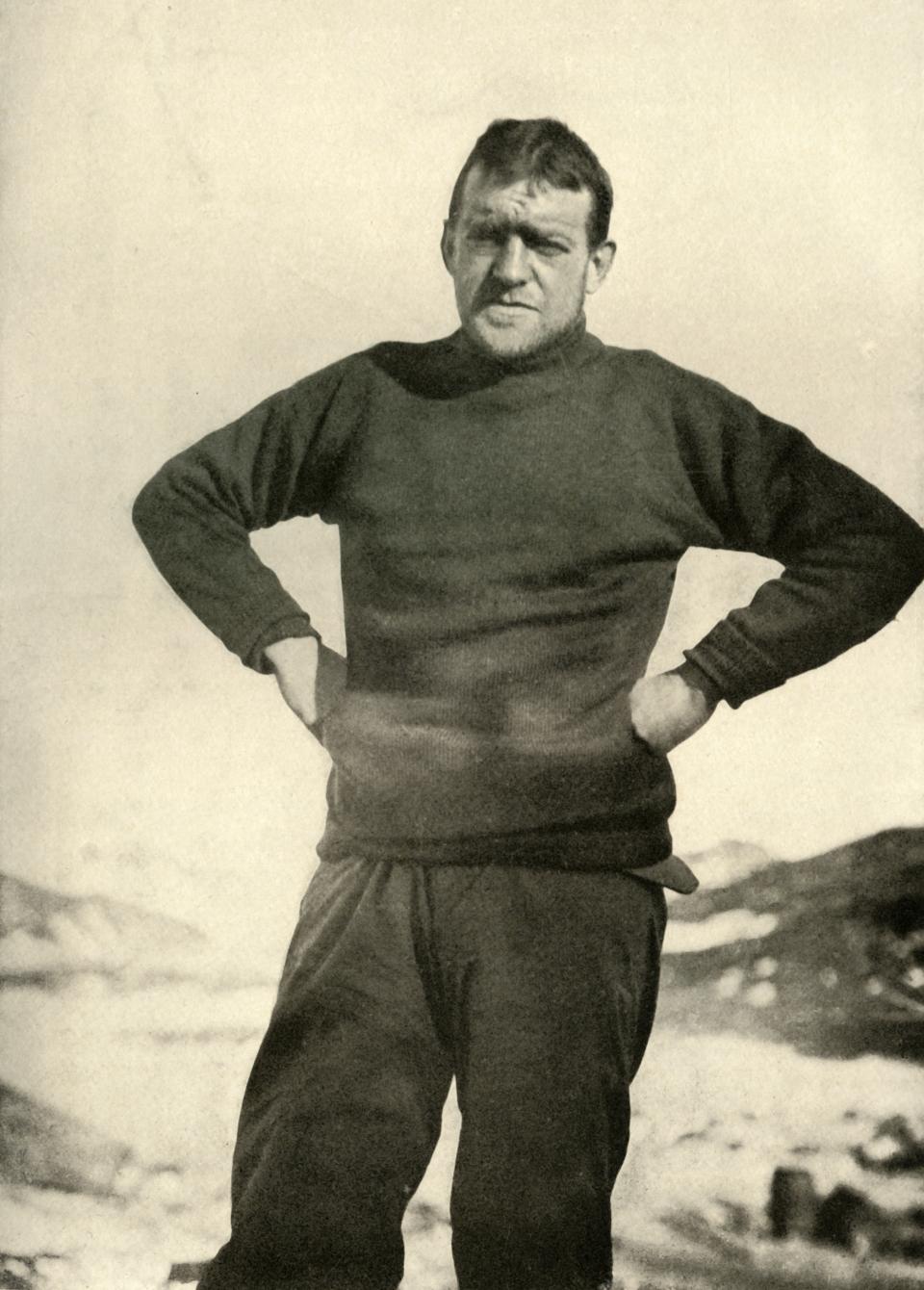 The Leader of the Expedition in Winter Garb', circa 1908, (1909). Anglo-Irish explorer Ernest Shackleton (1874-1922) in a jumper. Shackleton made three expeditions to the Antarctic. During the second expedition, 1907-1909, he and three companions established a new record, Farthest South latitude at 88°S, only 97 geographical miles (112 statute miles, or 180 km) from the South Pole, the largest advance to the pole in exploration history. Members of his team also climbed Mount Erebus, the most active volcano in the Antarctic. Shackleton was knighted by King Edward VII for these achievements. He died during his third and last 'oceanographic and sub-antarctic' expedition, aged 47. Illustration from The Heart of the Antarctic, Vol. I, by E. H. Shackleton, C.V.O. [William Heinemann, London, 1909]. Artist Unknown. (Photo by Print Collector/Getty Images)