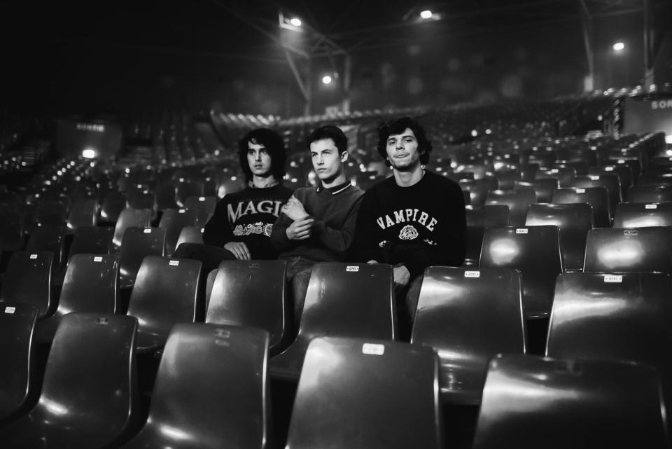 Wallows band members Cole Preston, Dylan Minnette and Braeden Lemasters in an empty theater.  (Photo: Joeseth Carter)