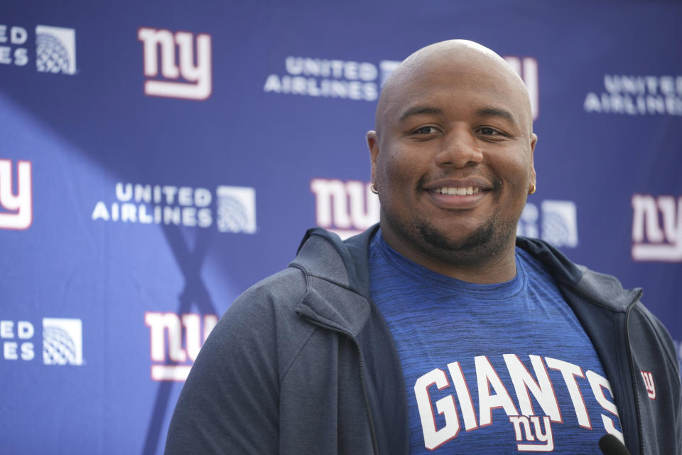 New York Giants defensive tackle Dexter Lawrence (97) speaks during a news conference at Hanbury Manor in Ware, England, Friday, Oct. 7, 2022 ahead the NFL game against Green Bay Packers at the Tottenham Hotspur stadium on Sunday. (AP Photo/Kin Cheung)