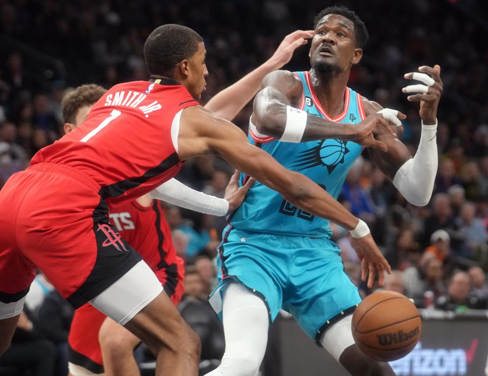 Dec 2, 2022; Phoenix, AZ, USA; Phoenix Suns gcenter 	Deandre Ayton (22) has the ball knocked away be Houston Rockets forward 	Jabari Smith Jr. (1) at Footprint Center. Mandatory Credit: Joe Rondone-Arizona Republic