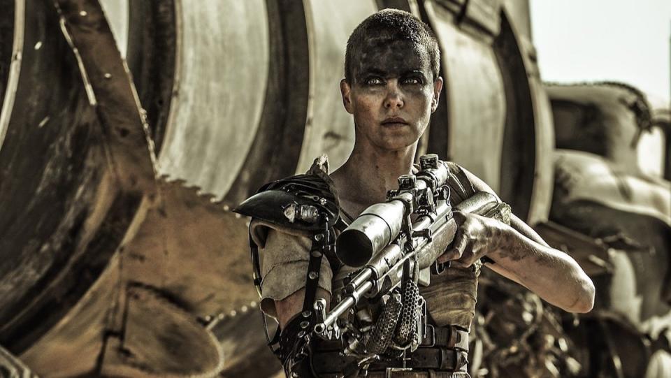 Furiosa holds a large gun in Mad Max: Fury Road