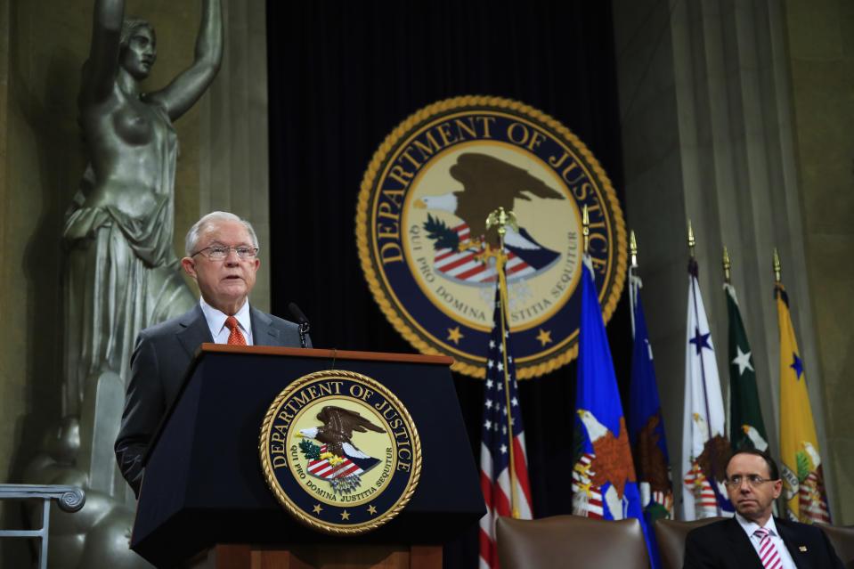 Attorney General Jeff Sessions speaks during a Religious Liberty Summit at the Department of Justice, Monday, July 30, 2018. Seated on the right is Deputy Attorney General Rod Rosenstein. (AP Photo/Manuel Balce Ceneta)