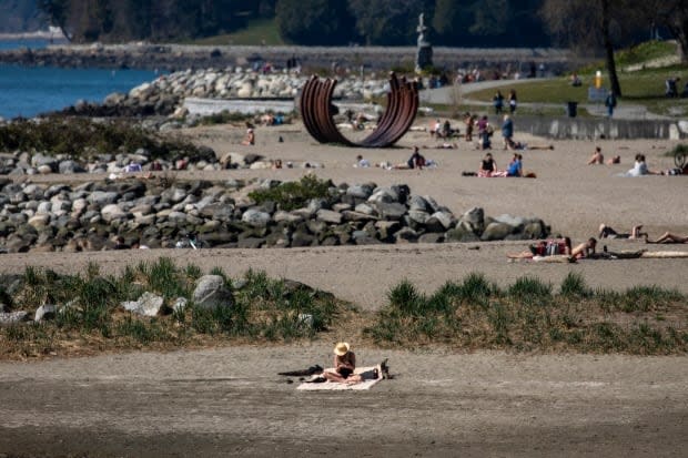 People are pictured enjoying the sunshine at Sunset Beach in Vancouver on Thursday.  (Ben Nelms/CBC - image credit)