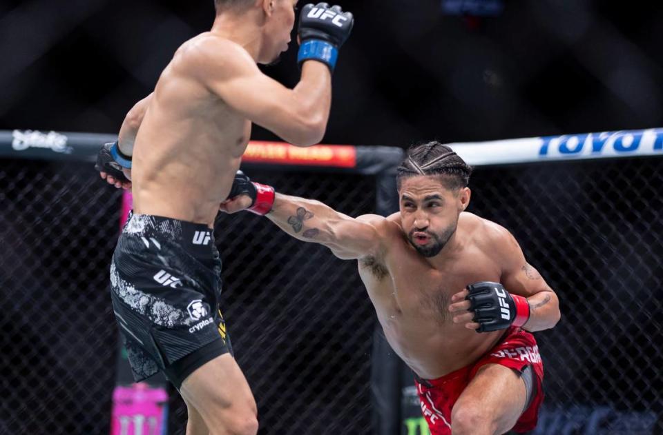 CJ Vergara from the United States and Asu Almabayev from Kazakhstan fight during their flyweight title match during the UFC 299 event at the Kaseya Center on Saturday, March 9, 2024, in downtown Miami, Fla. MATIAS J. OCNER/mocner@miamiherald.com