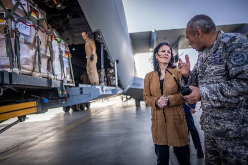 German Foreign Minister, Annalena Baerbock stands in front of an A400M German Air Force plane with aid supplies for Gaza. Michael Kappeler/dpa