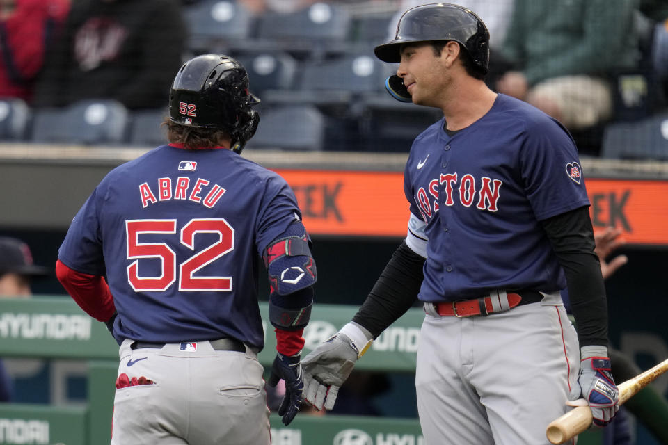 Boston Red Sox's Wilyer Abreu (52) is greeted by Triston Casas, right, after hitting a solo home run off Pittsburgh Pirates starting pitcher Quinn Priester during the first inning of a baseball game in Pittsburgh, Friday, April 19, 2024. (AP Photo/Gene J. Puskar)