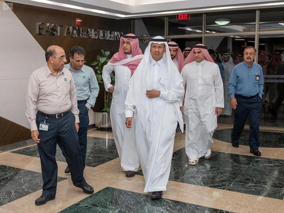 In this Sunday, Sept. 15, 2019, photo released by Saudi Press Agency, SPA, Saudi Energy Minister Prince Abdulaziz bin Salman, center, visits the Saudi Aramco plants one day after the attacks in Abqaiq, Saudi Arabia. (Saudi Press Agency via AP)