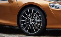 <p>The 15-spoke wheels shown here, sized 20 inches up front and 21 in the rear, are GT options. A seven-spoke design comes standard. As do iron brake rotors. Carbon-ceramic units are optional.</p>