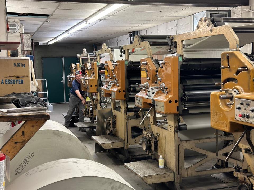 Whitehorse Star spokesman Don Campbell at work.  He says it's unclear what will happen to the reliable machine that has printed the Whitehorse Star for decades. "That's the really, really sad part.  It's almost 60 years old and no one wants it."