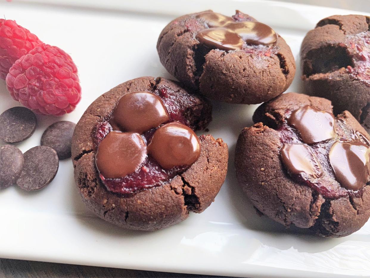 They're small, so you can eat more of these chocolate and raspberry thumbprint cookies.