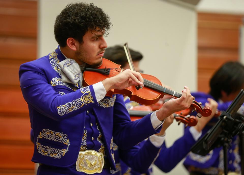 Denison High School senior Esteban Castellanos plays his violin as the Mariachi Reyes del Oeste, the high school's top mariachi ensemble, performs during the 2022 Fiesta Mariachi.
