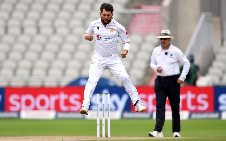 Pakistan's Yasir Shah celebrates taking the wicket of England's Jos Buttler  - PA