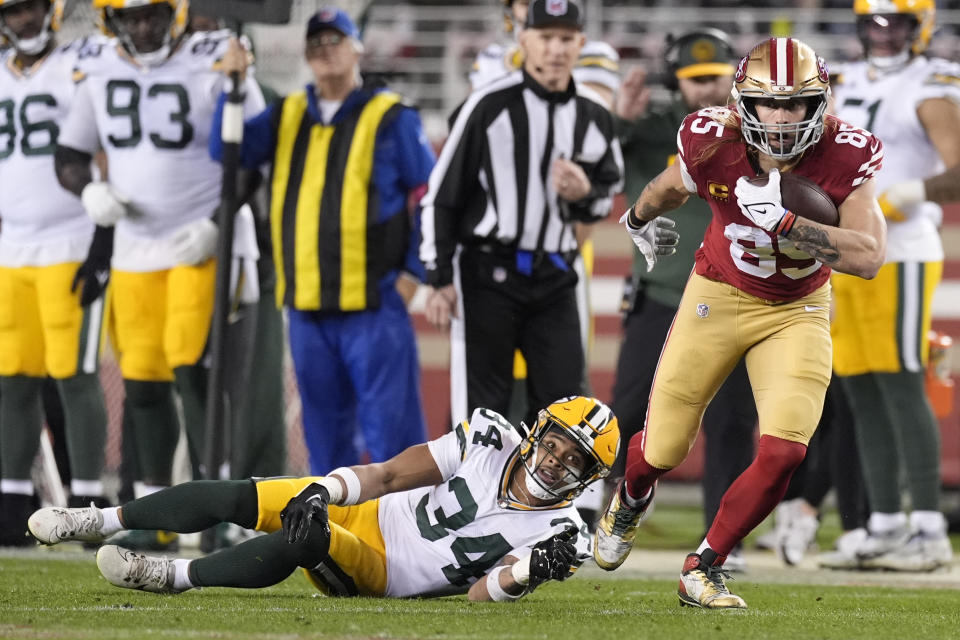 San Francisco 49ers tight end George Kittle (85) runs against Green Bay Packers safety Jonathan Owens (34) during the second half of an NFL football NFC divisional playoff game Saturday, Jan. 20, 2024, in Santa Clara, Calif. (AP Photo/Godofredo A. Vásquez)