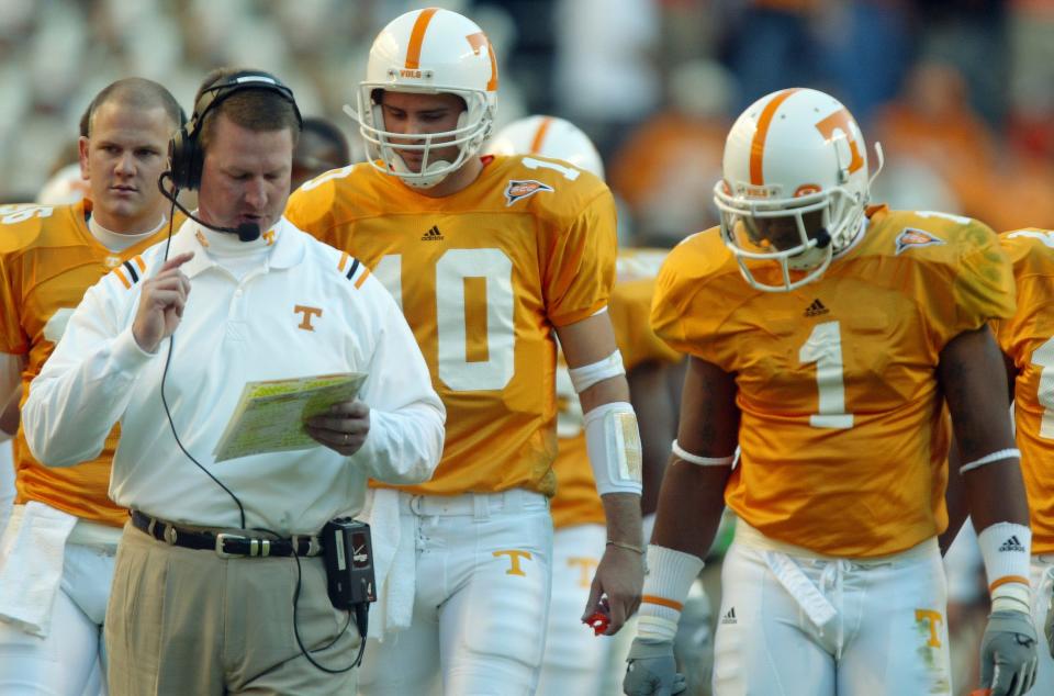 The Vols' 2005 game at LSU was dramatic for a number of reasons, including the two quarterbacks, Rick Clausen and Erik Ainge, shown here in 2004 with offensive coordinator Randy Sanders. Sanders stepped down later in the season.