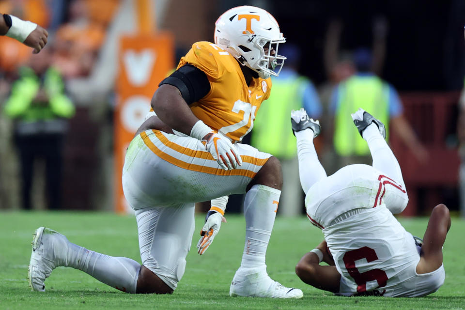 Tennessee defensive lineman Omari Thomas tackles Alabama quarterback Bryce Young at Neyland Stadium on October 15, 2022 in Knoxville, Tennessee. Henry To'oTo'o (Photo by Donald Page/Getty Images)