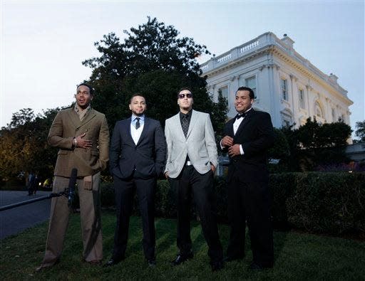 Members of the band Aventura from left to right, Romeo Santos, Henry Santos, Max Santos, and Lenny Santos are seen on the South Lawn of the White House on Tuesday in Washington before a performance celebrating Hispanic musical heritage.
