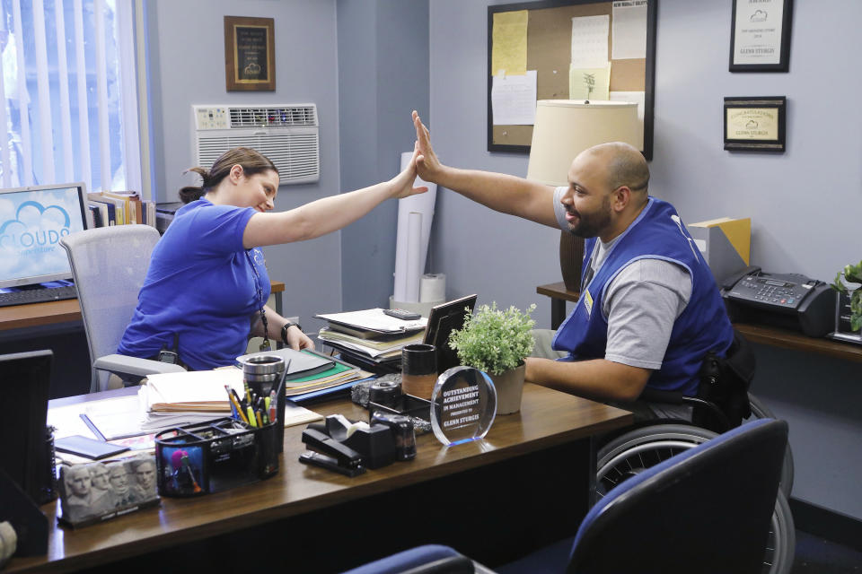 Dina and Garrett high fiving