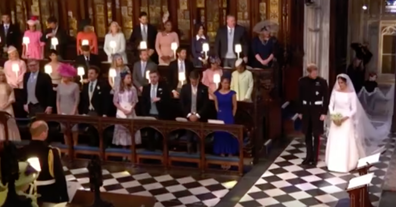 Meghan and Harry were seen facing the Queen as they re-entered the chapel after their vows.