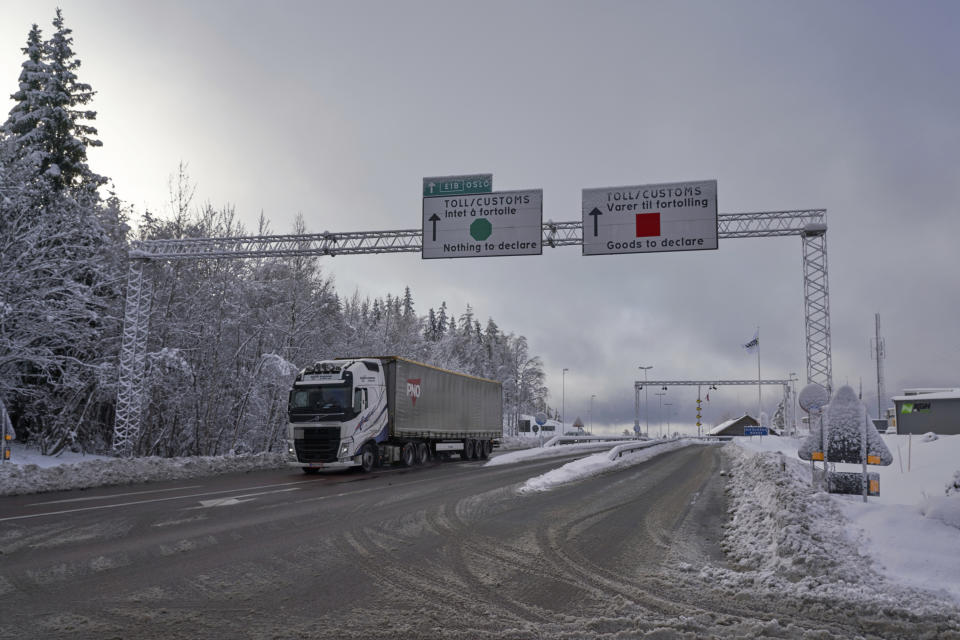 A truck passes the Norwegian border towards Sweden, on Friday, Feb. 8 2019. Norway's hard border with the European Union is equipped with cameras, license-plate recognition systems and barriers directing traffic to Customs officers. Norway's membership in the European Economic Area (EEA) grants it access to the common market and most goods are exempt from paying duties but everything entering the country must be declared and cleared through customs. (AP Photo/David Keyton)