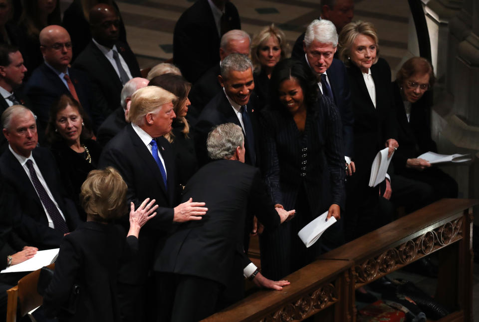 Former President George W. Bush and Michelle Obama had another sweet moment, this time at his father’s funeral. (Photo: Andrew Harrer/Bloomberg via Getty Images)