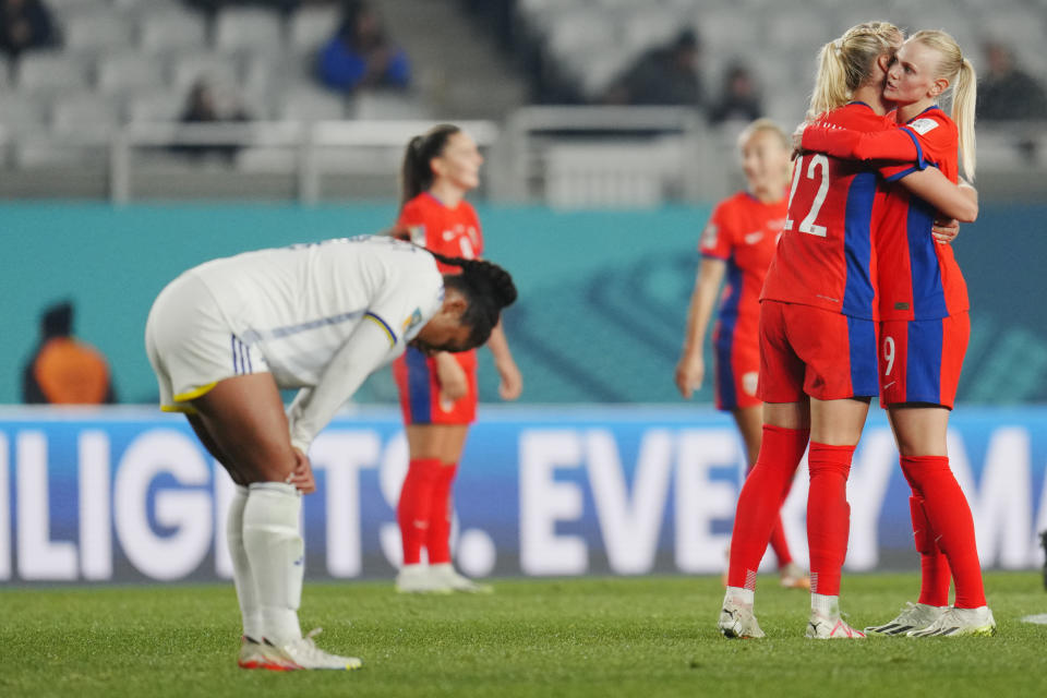 Norway's Karina Saevik, right, hugs her teammate Sophie Roman Haug at the end of the Women's World Cup Group A soccer match between Norway and Philippines at Eden Park stadium in Auckland, New Zealand, Sunday, July 30, 2023. Sophie Roman Haug scored a hat trick in Norway's 6-0 victory. (AP Photo/Abbie Parr)