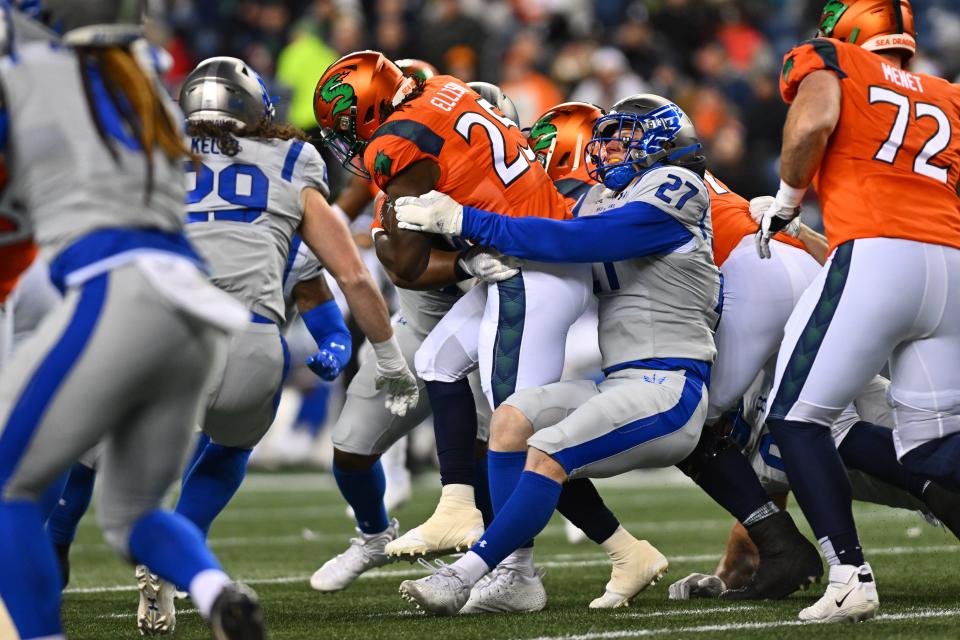 Former Iowa State and St. Louis Battlehawks linebacker Mike Rose (27) tackles Seattle Sea Dragons running back Morgan Ellison (25) during the first half at Lumen Field.