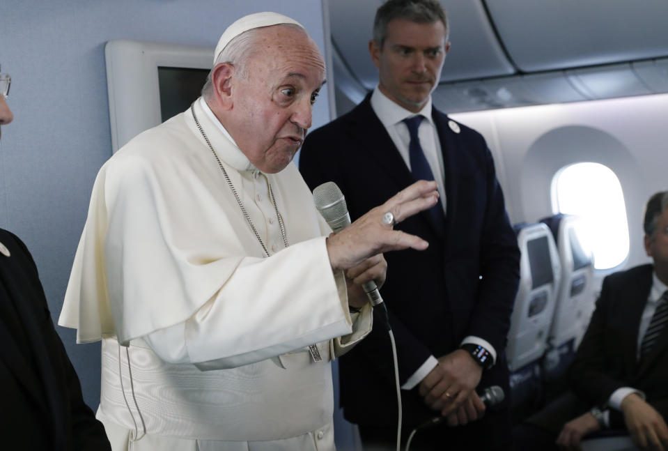 Pope Francis speaks during a news conference onboard the papal plane on his flight back from a trip to Thailand and Japan, Monday, Nov. 26, 2019. (Remo Casilli/Pool Photo via AP)